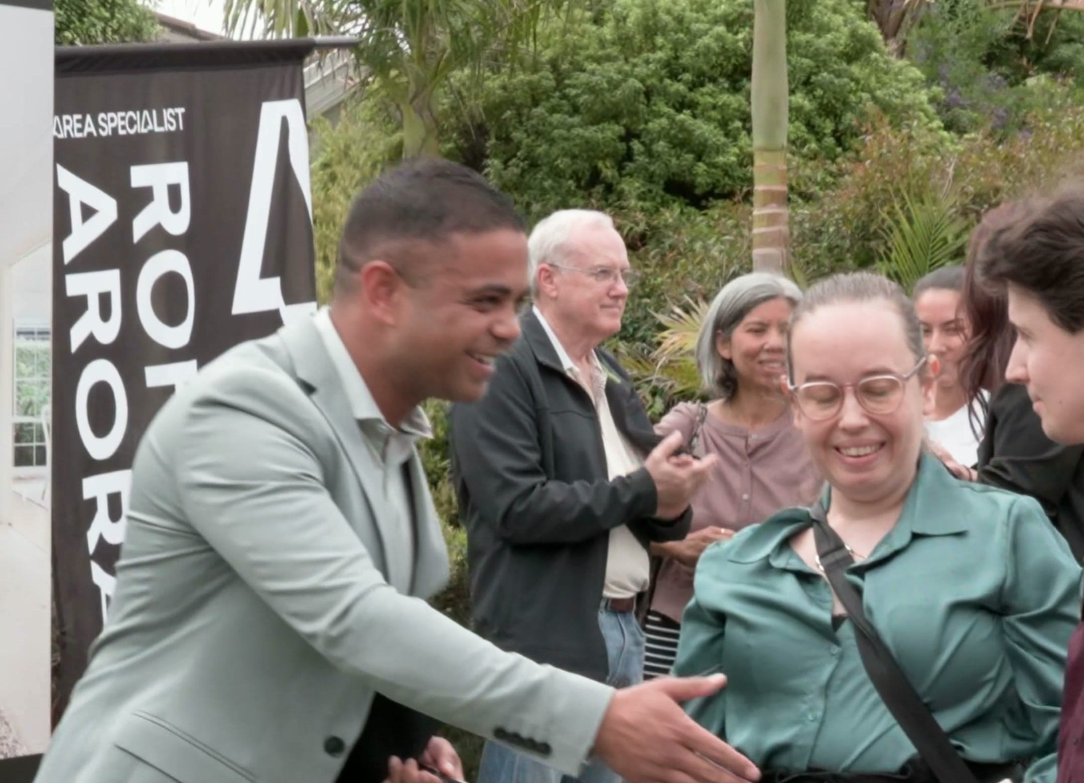 Rohin Arora shaking hands with the crowd after the auction at 14 Willow Road