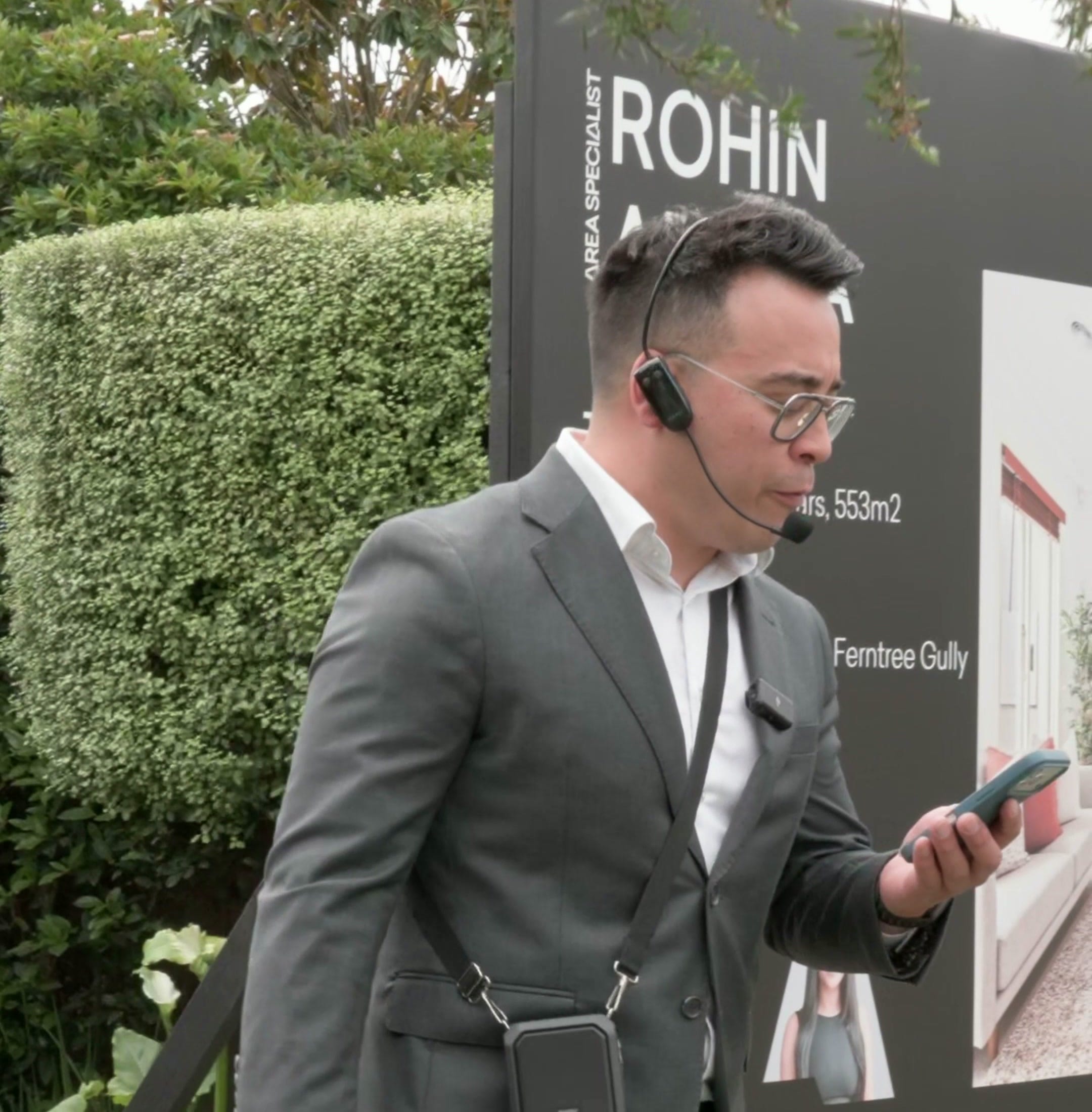 The auctioneer opening the auction on the footpath outside 14 Willow Road